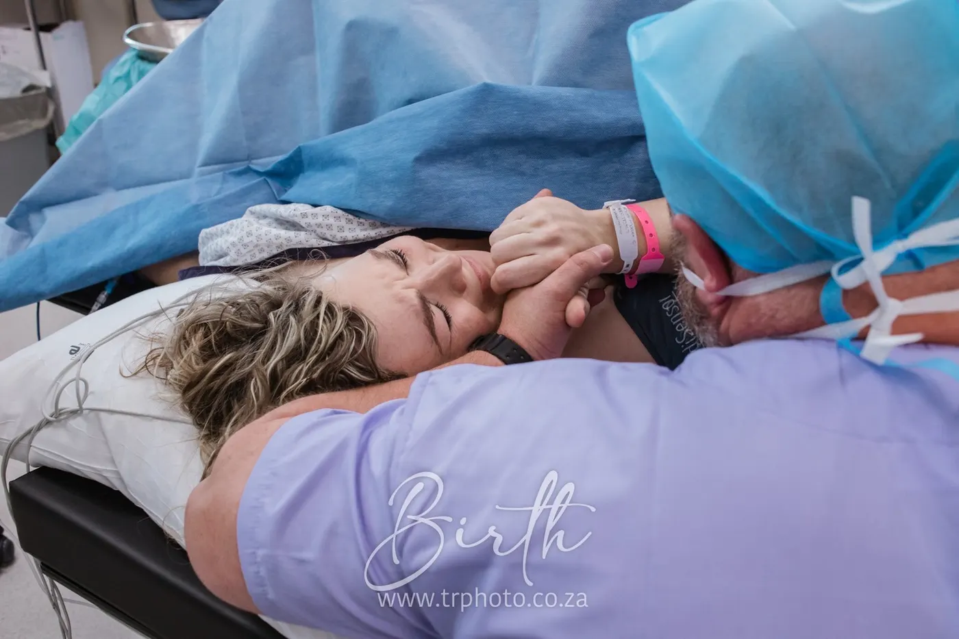 A mother meeting her baby during a C-section